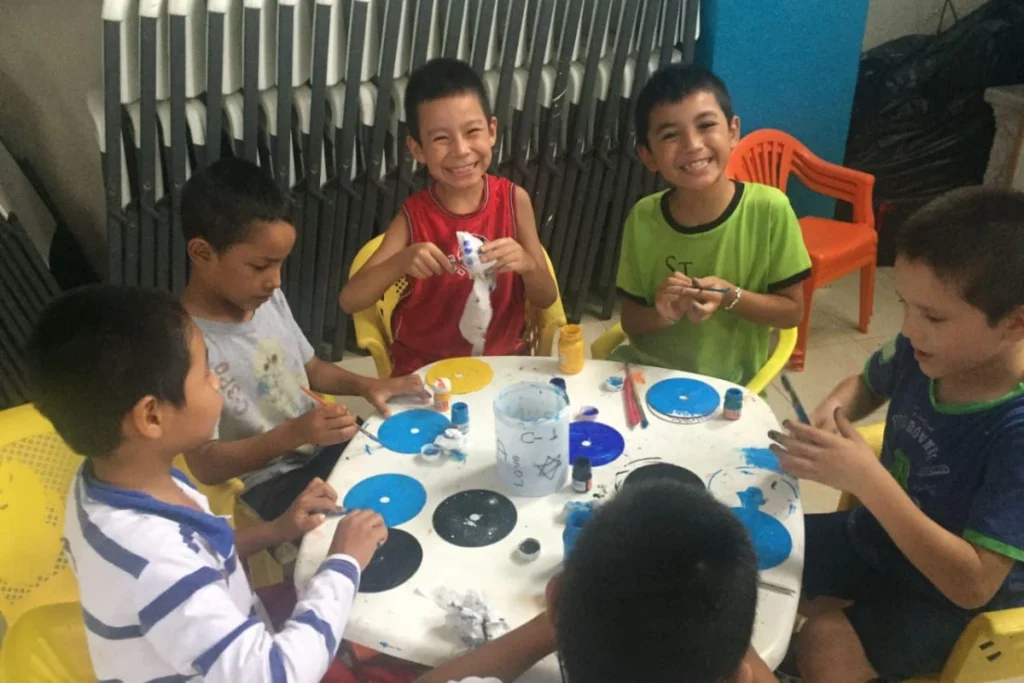 Children enjoying a painting activity.