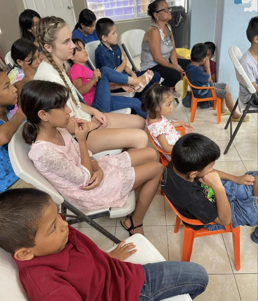 Children attentively watching something together.